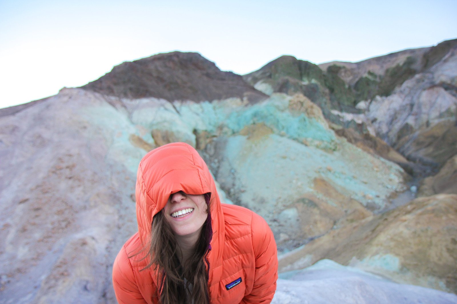 woman with her faced covered in Death Valley