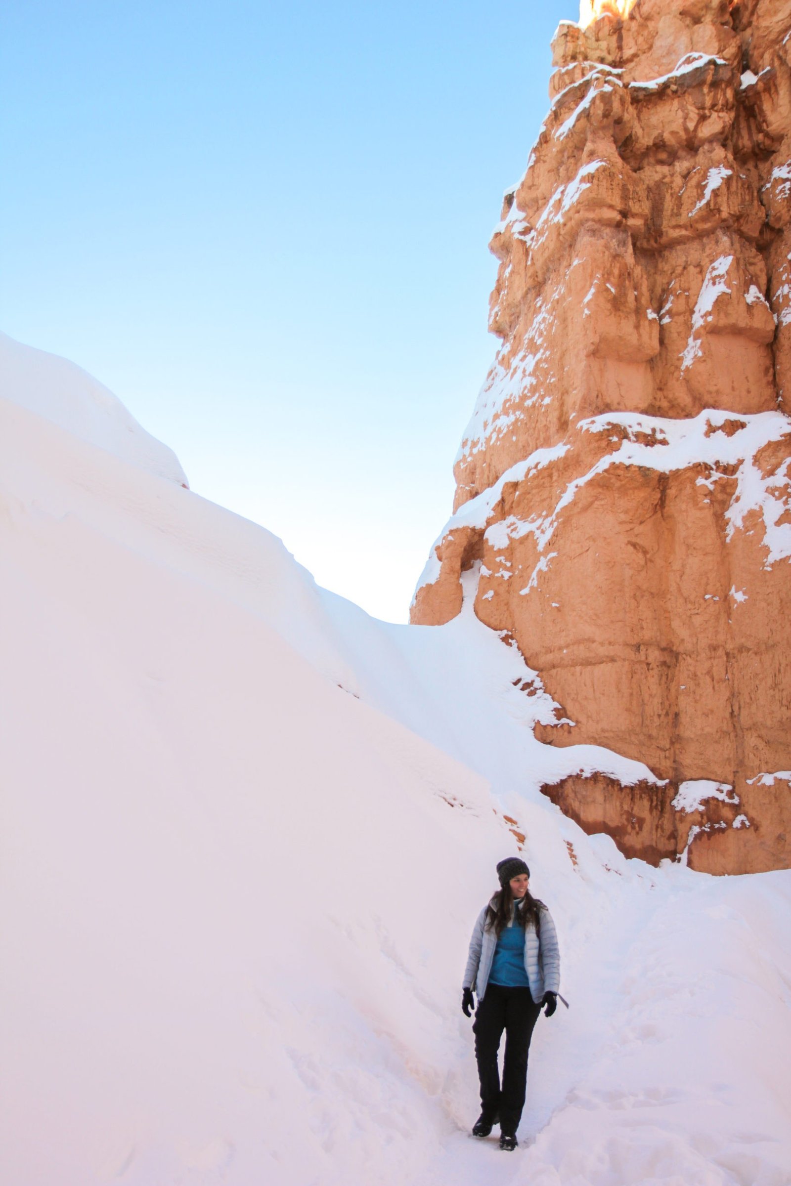 woman hiking in bryce canyon national park in the winter