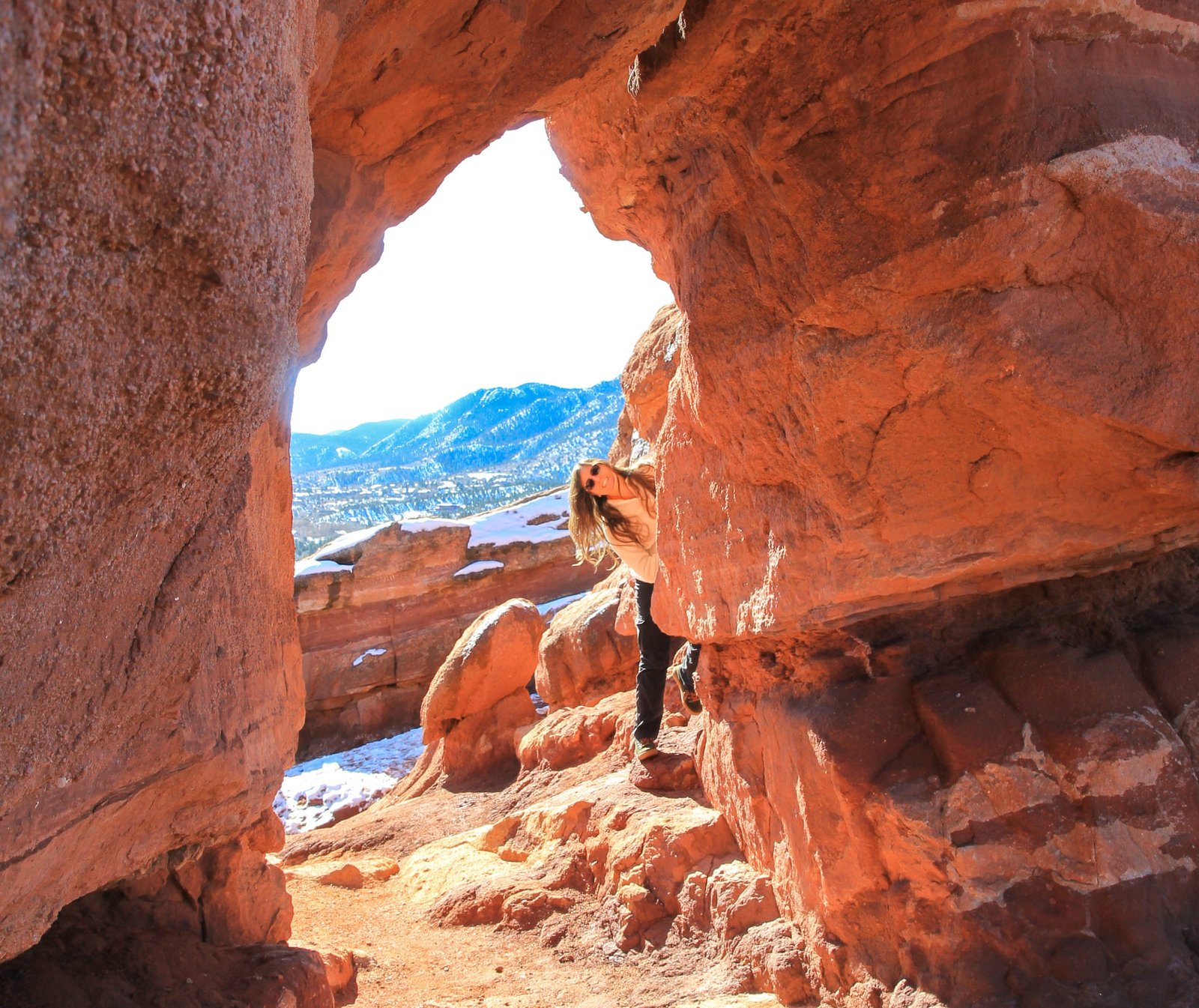 Woman hiking around orange rocks