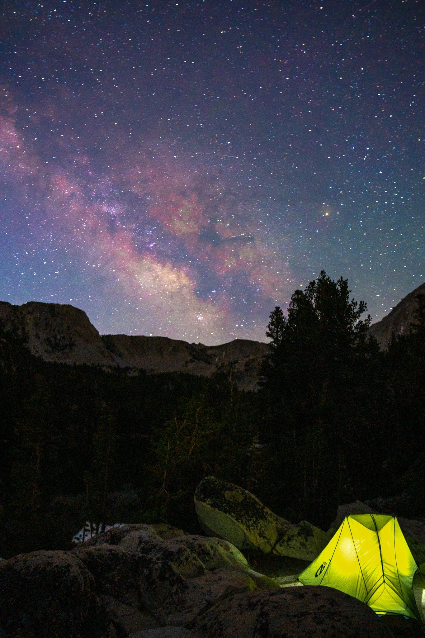 milky way stars above tent in mountains