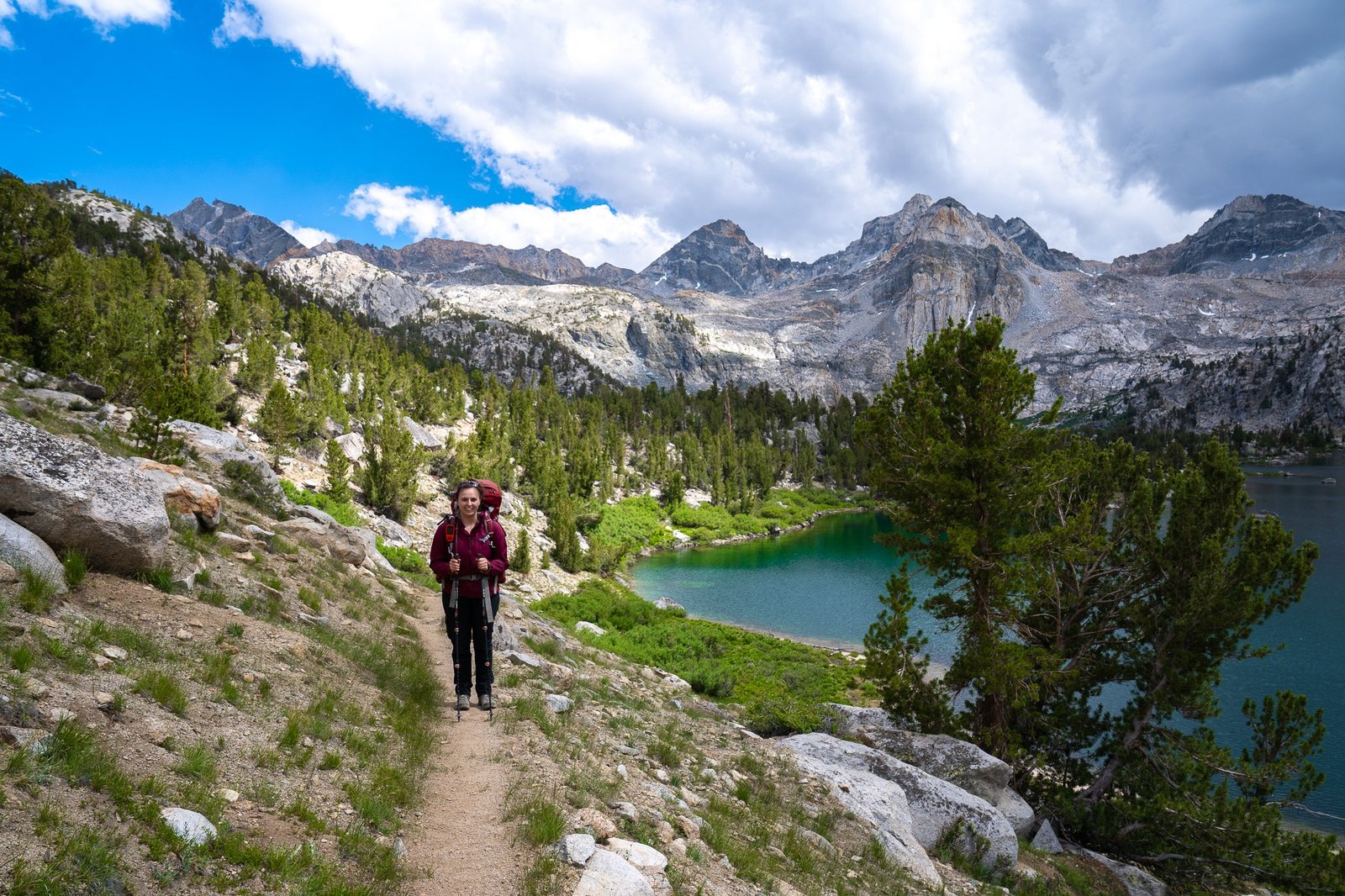 woman hiking next to rae lakes loop